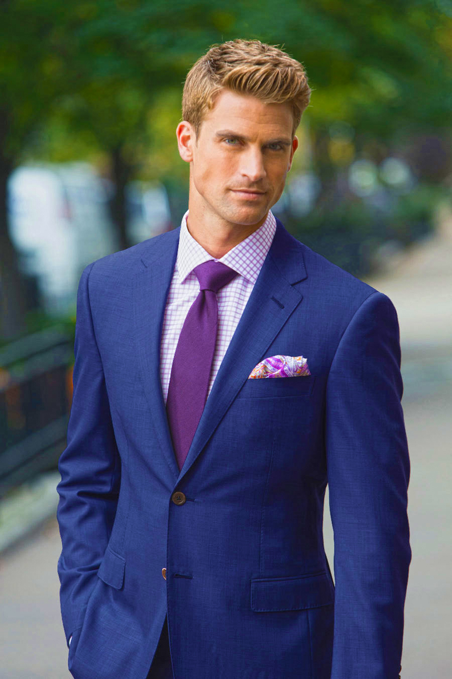 Blue suit with a purple shirt and slightly darker purple tie