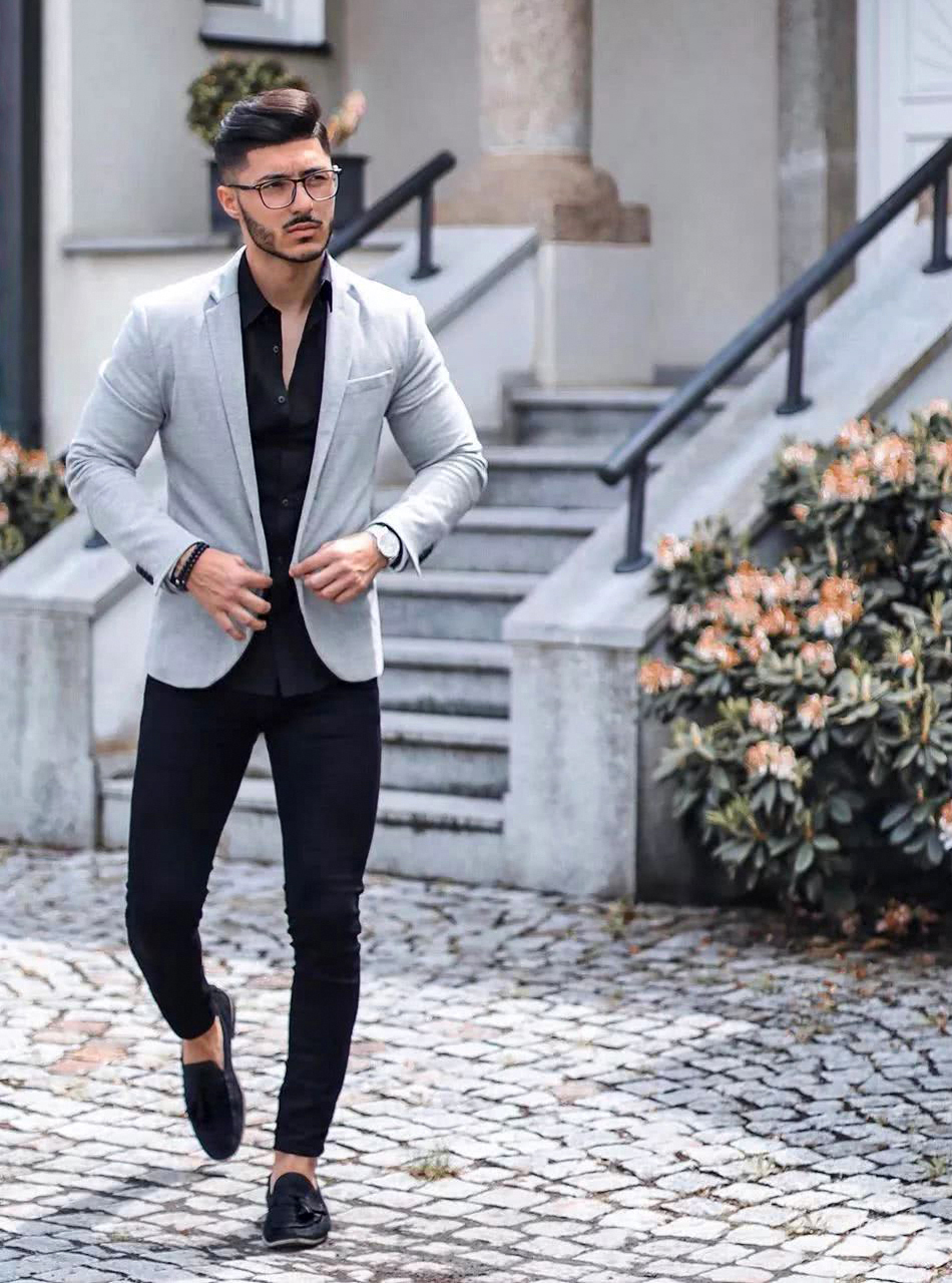 grey jacket and black trousers