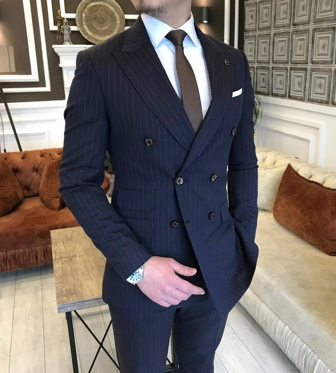 Navy double-breasted suit with peak lapels and white dress shirt